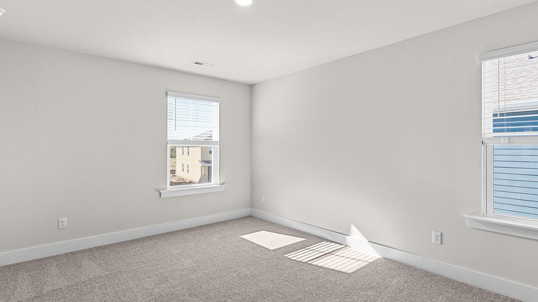 Spacious, unfurnished interior of a new home in The Haven at Indigo Preserve, Leland (Image 24).