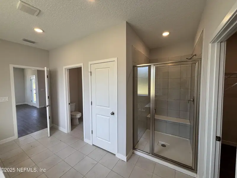 Spacious, unfurnished interior of a new home in The Cypress Series at Reserve East, Flagler Beach (Image 11).