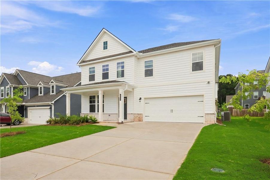 Front exterior of a new home in Cooper Park, McDonough, GA, highlighting curb appeal (Image 17). Front exterior of a new home in Cooper Park, McDonough, GA, highlighting curb appeal (Image 17).