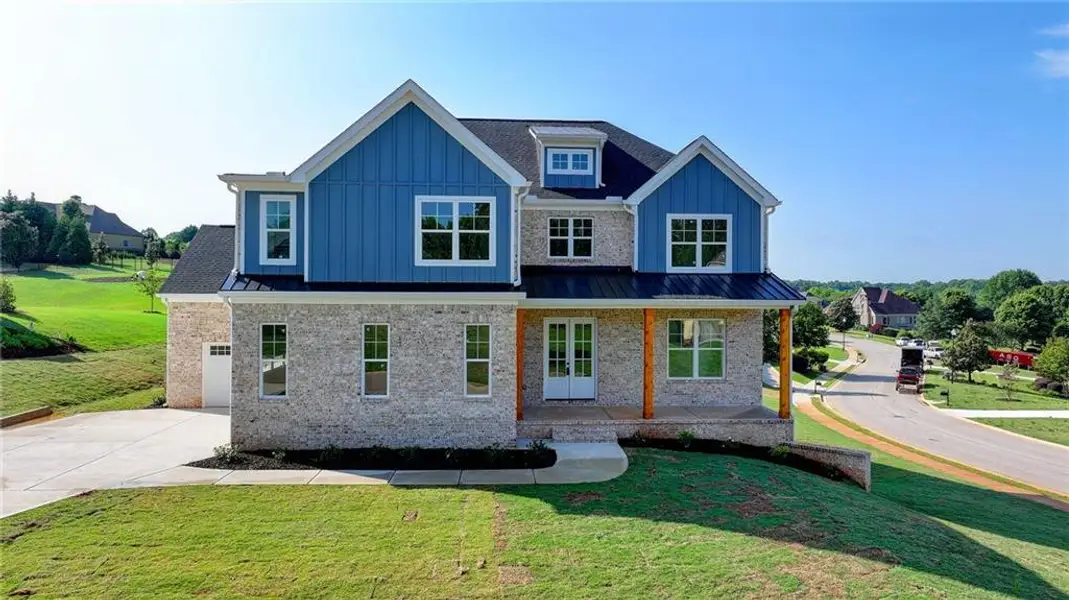 Front exterior of a new home in , Jefferson, GA, highlighting curb appeal (Image 1).