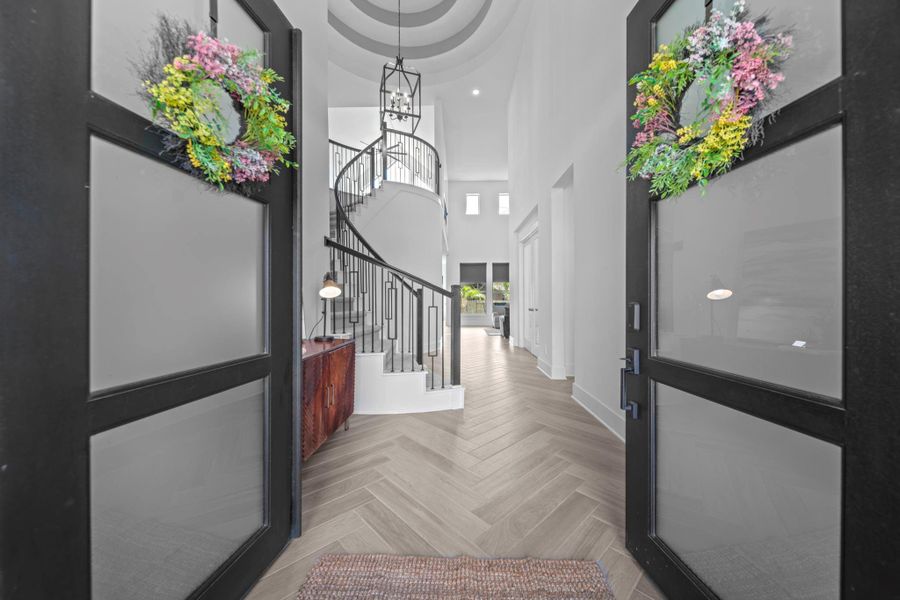 The foyer sets the tone with herringbone flooring and a sweeping staircase. Light and space greet you the moment you step inside. The foyer sets the tone with herringbone flooring and a sweeping staircase. Light and space greet you the moment you step inside.