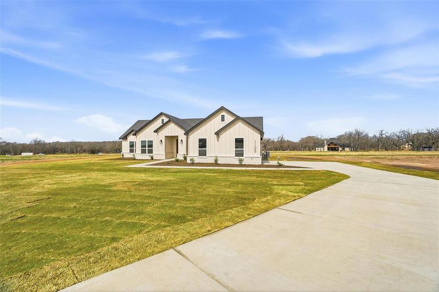 Front exterior of a new home in Taylor Ranch, Springtown, TX, highlighting curb appeal (Image 19).