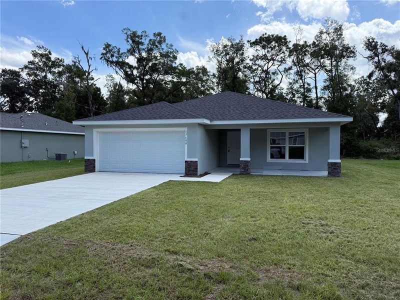 Front exterior of a new home in , Dunnellon, FL, highlighting curb appeal (Image 10).