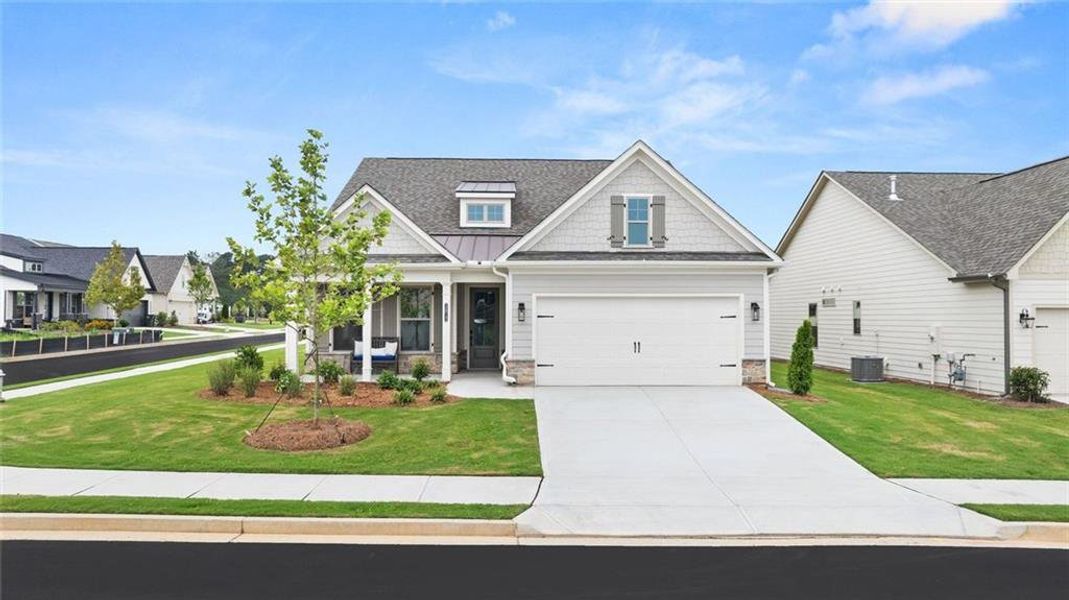 Front exterior of a new home in Soleil Summit Chase, Snellville, GA, highlighting curb appeal (Image 1). Front exterior of a new home in Soleil Summit Chase, Snellville, GA, highlighting curb appeal (Image 1).