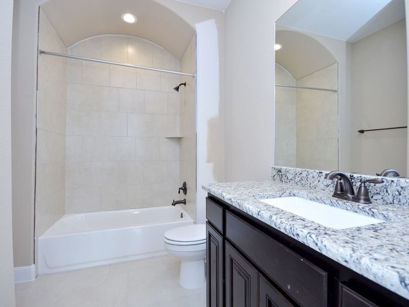 Representative furnished interior of a home built from the Madera II by Giddens Homes in Scofield Farms Estates, Georgetown (Image 218).