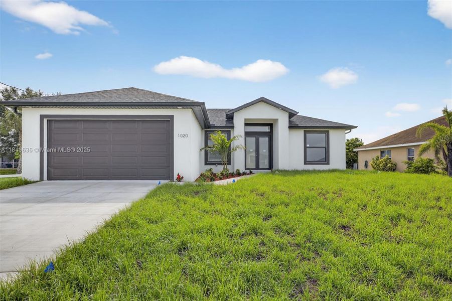 Front exterior of a new home in , Lehigh Acres, FL, highlighting curb appeal (Image 2). Front exterior of a new home in , Lehigh Acres, FL, highlighting curb appeal (Image 2).