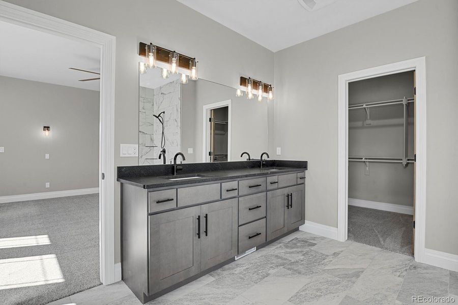 Double vanity and access to walk-in closet in primary bathroom