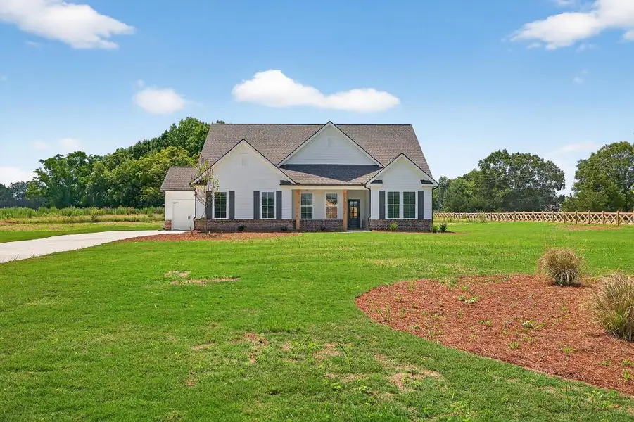Front exterior of a new home in , Good Hope, GA, highlighting curb appeal (Image 1). Front exterior of a new home in , Good Hope, GA, highlighting curb appeal (Image 1).
