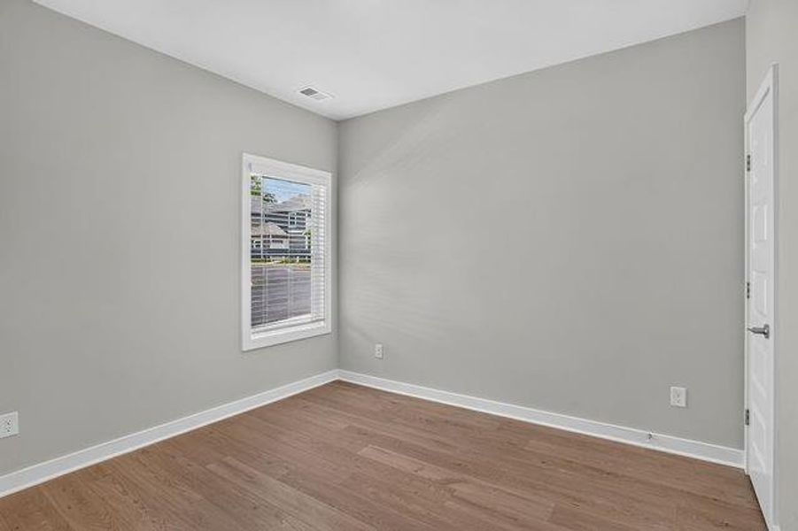 Spacious, unfurnished interior of a new home in The Cottages at East Lanier, Fayetteville (Image 11).
