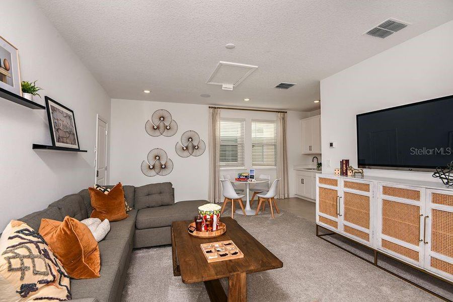 Furnished interior view inside a new home in Harvest at Ovation, Winter Garden (Image 24).
