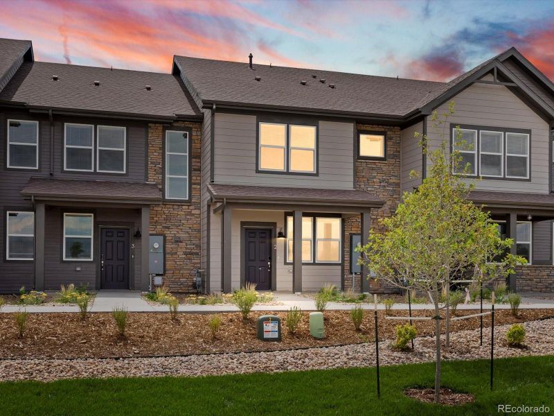 Front exterior of a new home in Poudre Heights: The Meadow Collection, Windsor, CO, highlighting curb appeal (Image 2). Front exterior of a new home in Poudre Heights: The Meadow Collection, Windsor, CO, highlighting curb appeal (Image 2).