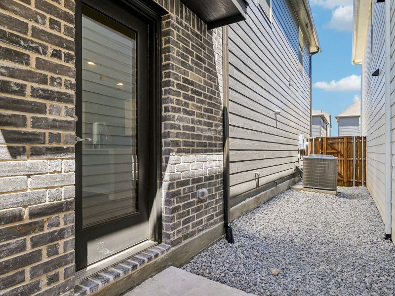 Exterior details and patio area of a home in Oak Ridge Park, Corinth (Image 4).