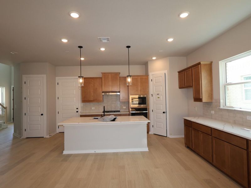 Furnished interior view inside a new home in Heritage, Dripping Springs (Image 4).