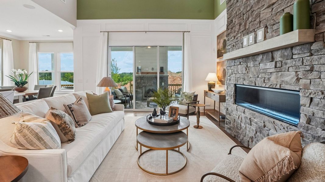Gathering room with fireplace and access to rear patio Gathering room with fireplace and access to rear patio