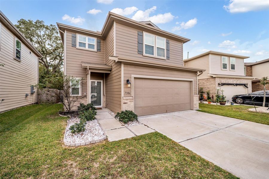 Front exterior of a new home in Forbes Crossing, Houston, TX, highlighting curb appeal (Image 2).