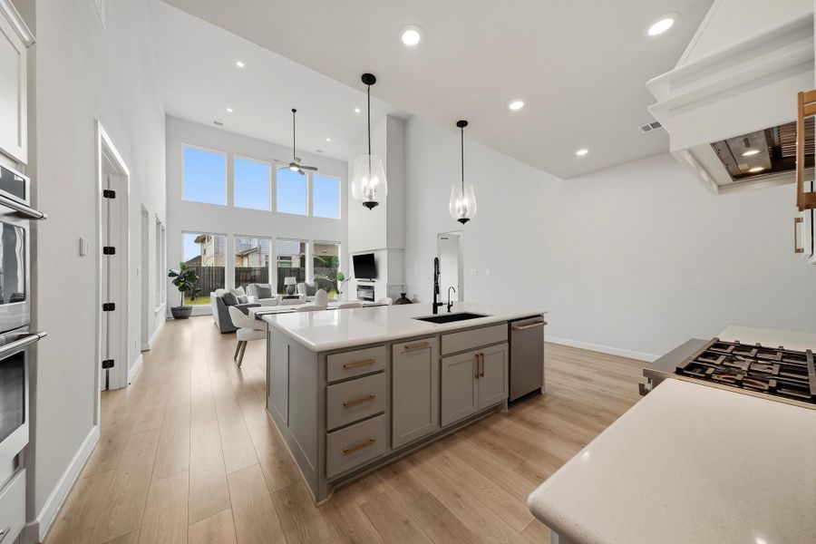 The kitchen opens gracefully to the dining area and family room, creating a sophisticated, cohesive layout designed for effortless entertaining while maintaining a strong sense of connection throughout the heart of the home.