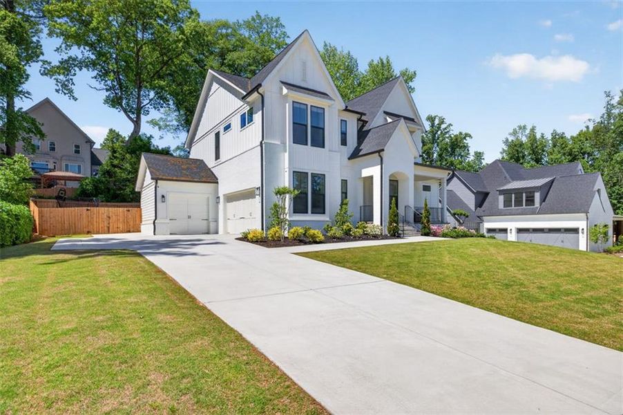 Front exterior of a new home in Town Farms, Peachtree Corners, GA, highlighting curb appeal (Image 29).