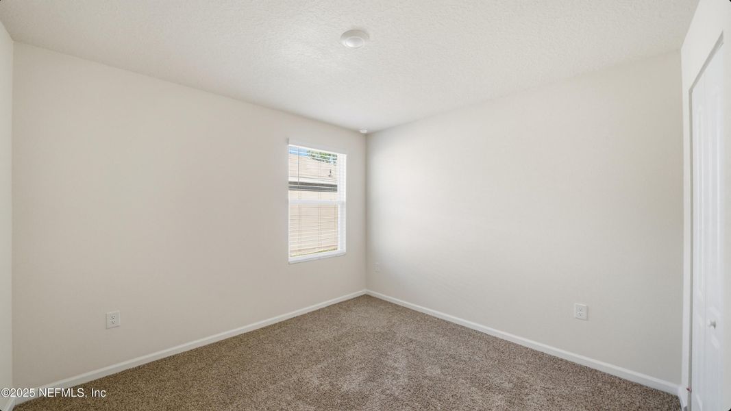 Spacious, unfurnished interior of a new home in River Glen Express, Yulee (Image 21).