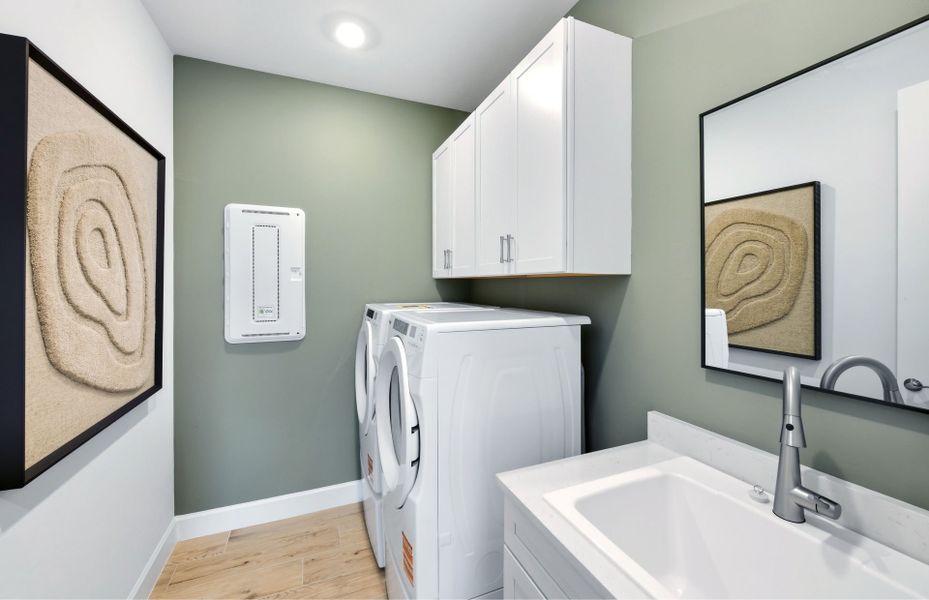 Representative furnished interior of a home built from the Palmary by DiVosta in BeachWalk by Manasota Key, Englewood (Image 13).