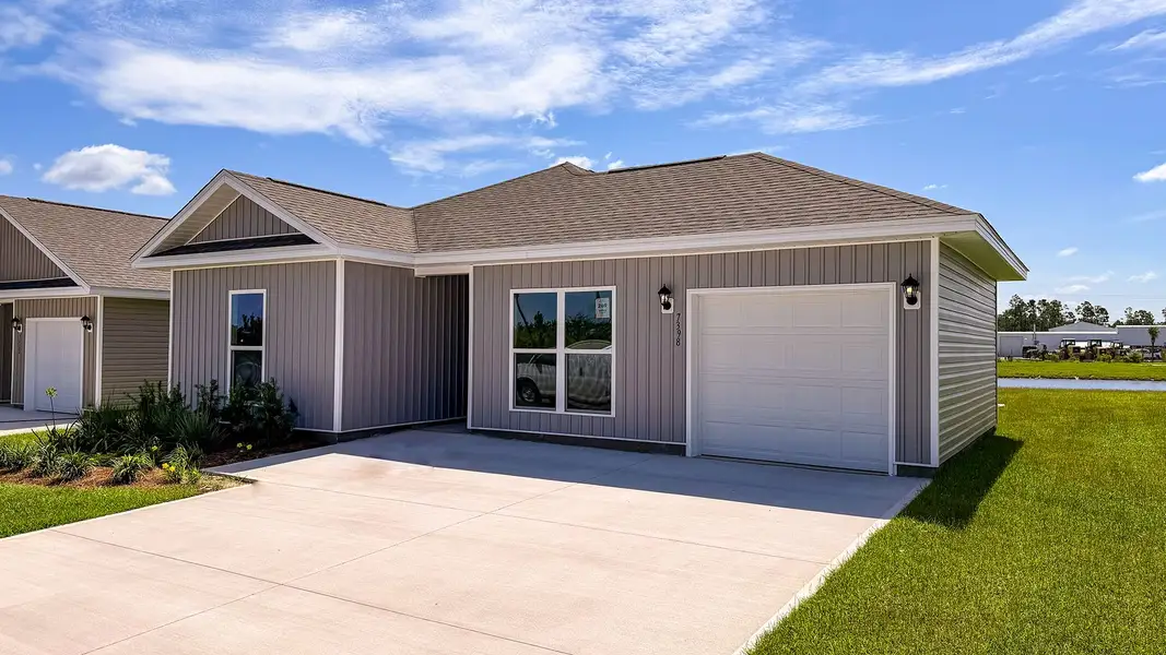 Front exterior of a new home in Liberty, Panama City, FL, highlighting curb appeal (Image 2). Front exterior of a new home in Liberty, Panama City, FL, highlighting curb appeal (Image 2).