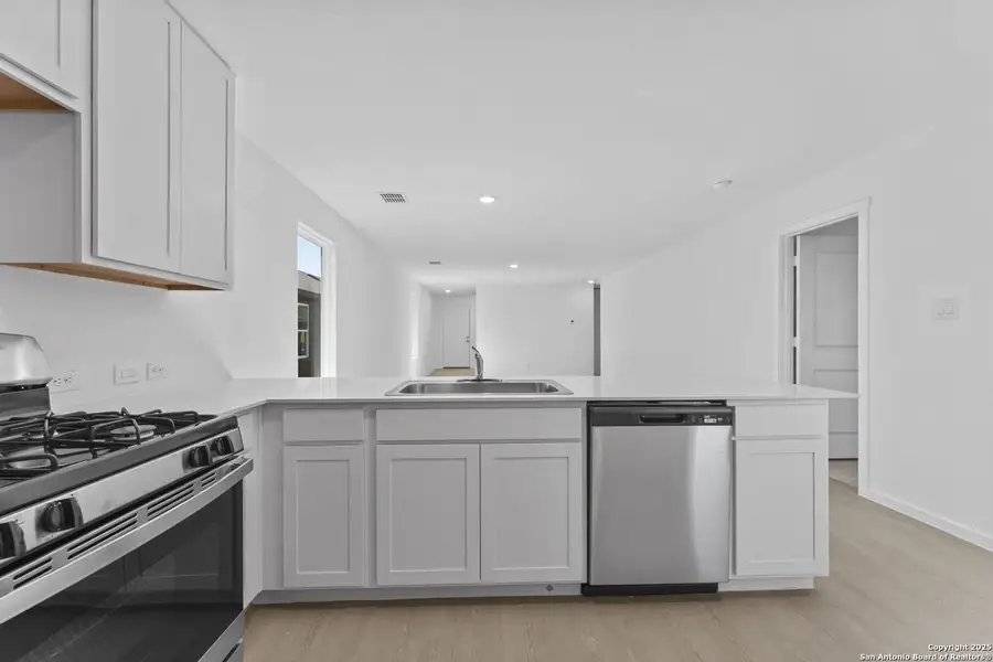 Furnished interior view inside a new home in Randolph Crossing: Cottage Collection, Converse (Image 7).
