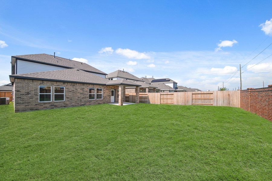 Exterior details and patio area of a home in Sunterra, Katy (Image 3). Exterior details and patio area of a home in Sunterra, Katy (Image 3).