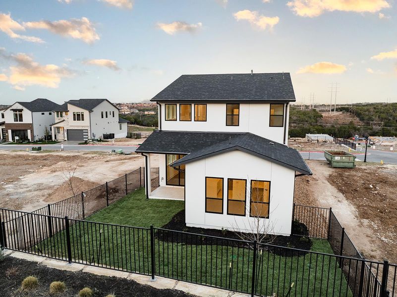Front exterior of a new home in Rough Hollow The District, Lakeway, TX, highlighting curb appeal (Image 19). Front exterior of a new home in Rough Hollow The District, Lakeway, TX, highlighting curb appeal (Image 19).