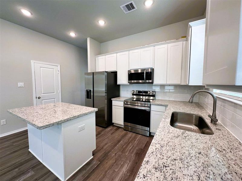 All stainless steel appliances in this incredible open concept!