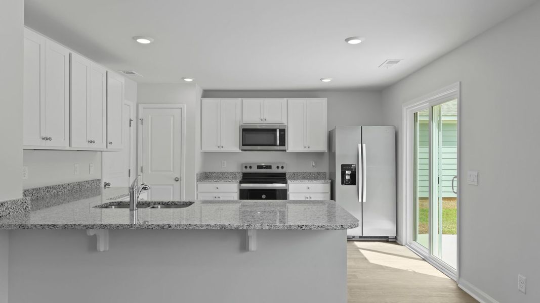 Representative furnished interior of a home built from the BRANDON by D.R. Horton in Center Pointe, Santee (Image 7).