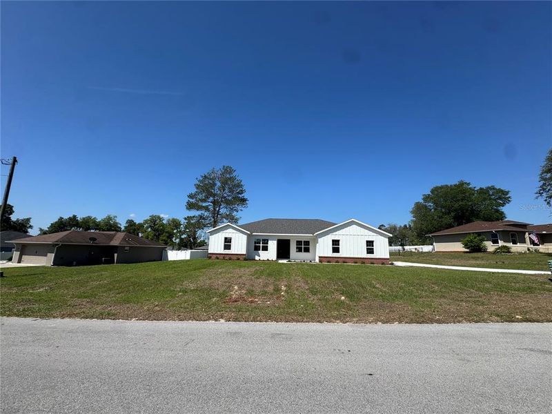 Front exterior of a new home in , Ocala, FL, highlighting curb appeal (Image 24).