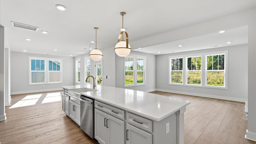 Exceptional craftsmanship shines through stacked cabinetry and sophisticated finishes