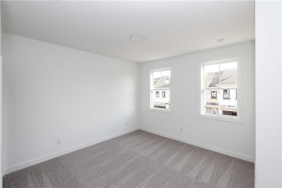 Secondary bedroom - walk in closet - all bedrooms on the same floor together - Pictures represent a previously built home, not the actual home.