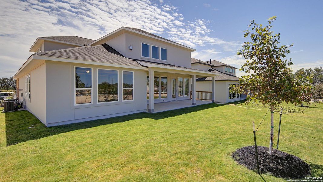 Front exterior of a new home in Esperanza 60', Boerne, TX, highlighting curb appeal (Image 1).
