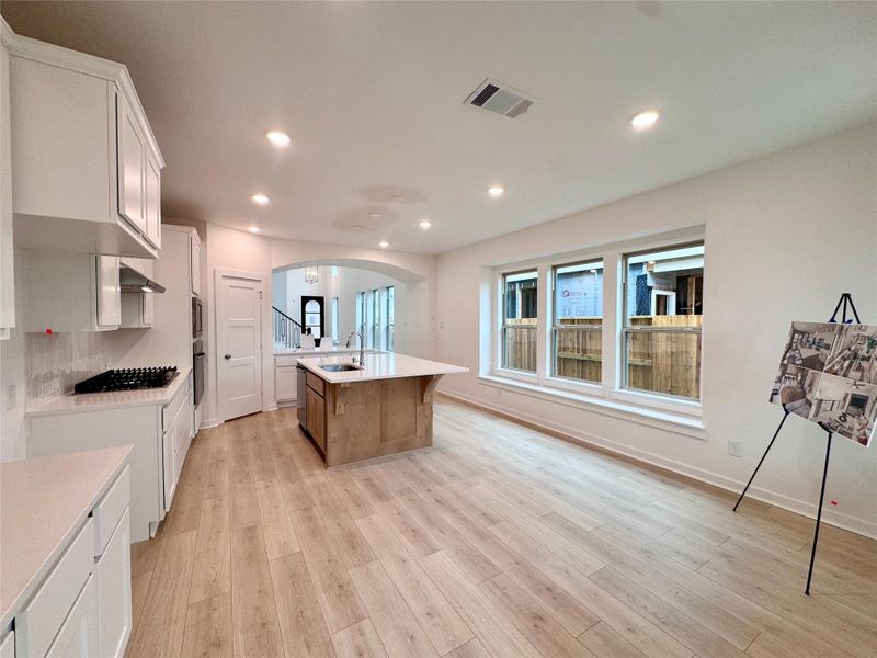 Nearly the entire wall is filled with cabinets galore! AND a window bench in the dining room?! You can easily seat 15 people in your kitchen.