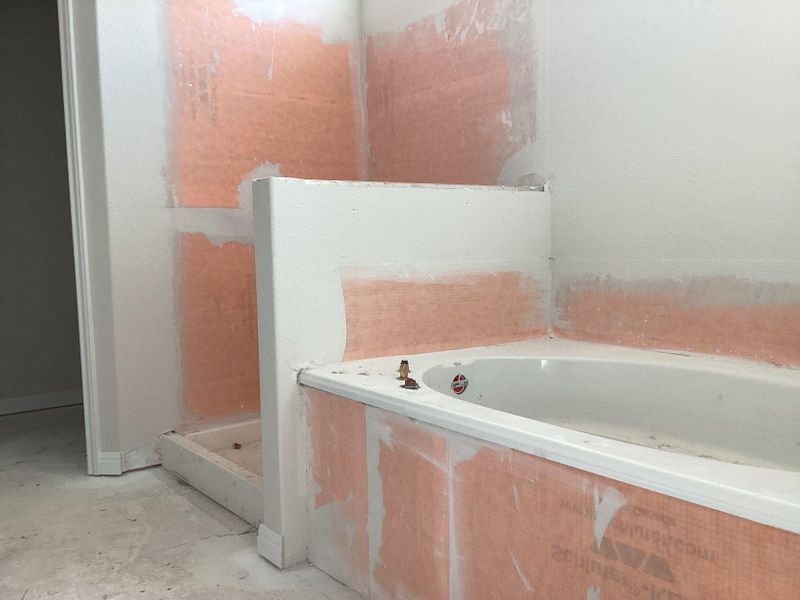 In-progress construction of a new home in The Cottages at Lariat, Liberty Hill, TX (Image 26).