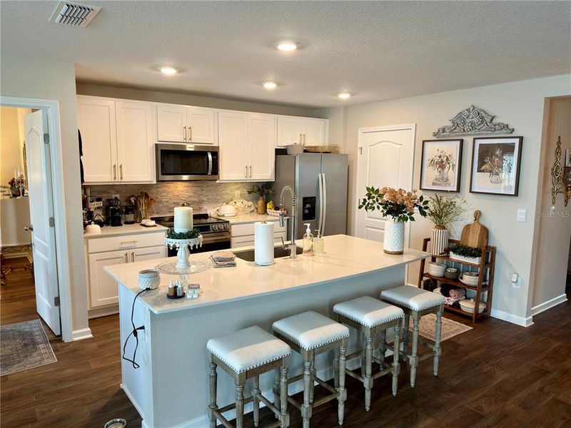 Furnished interior view inside a new home in Sawmill Branch Express, Palm Coast (Image 8).