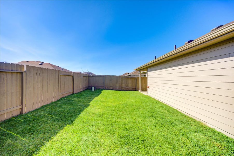 Exterior details and patio area of a home in Breckenridge Forest, Spring (Image 4).
