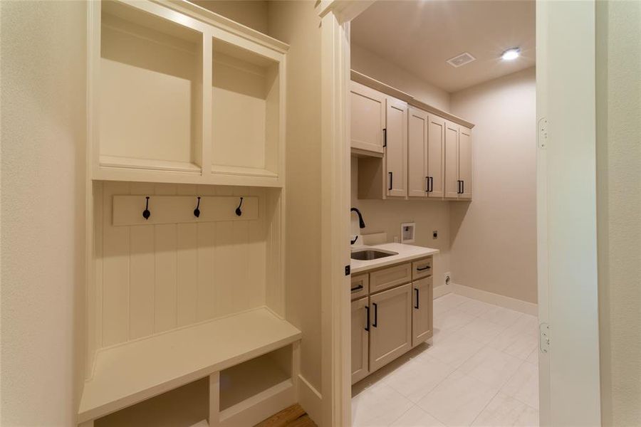 Mud room to laundry and garage.