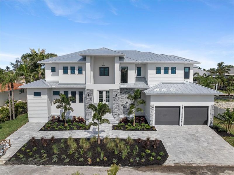 Front exterior of a new home in , Longboat Key, FL, highlighting curb appeal (Image 33). Front exterior of a new home in , Longboat Key, FL, highlighting curb appeal (Image 33).