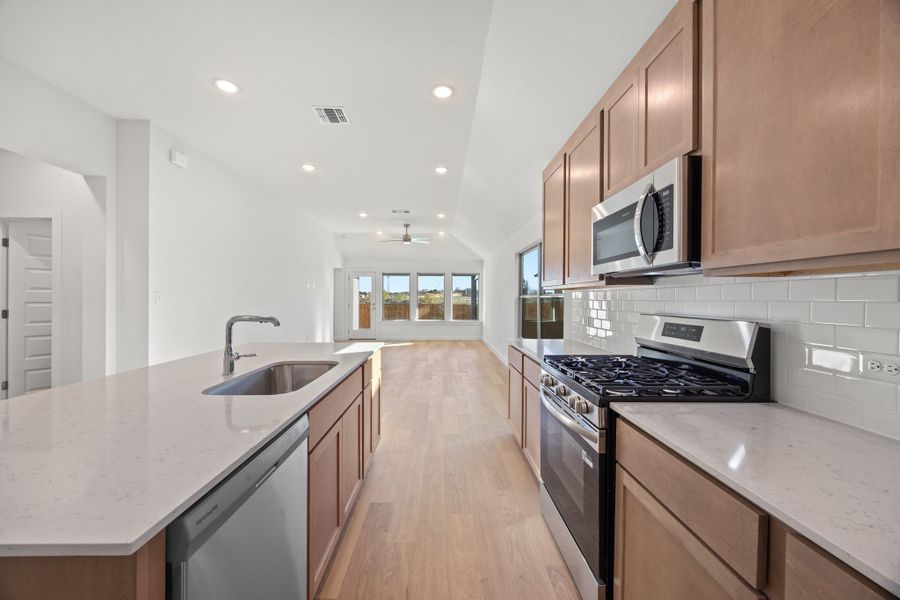 Kitchen in the Turquoise home plan by Trophy Signature Homes – REPRESENTATIVE PHOTO
