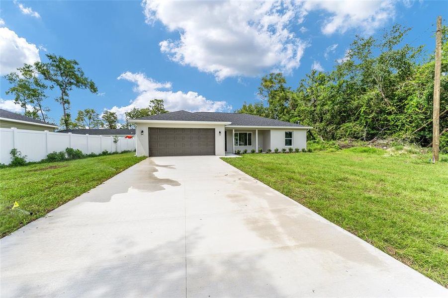 Front exterior of a new home in , Silver Springs, FL, highlighting curb appeal (Image 22).