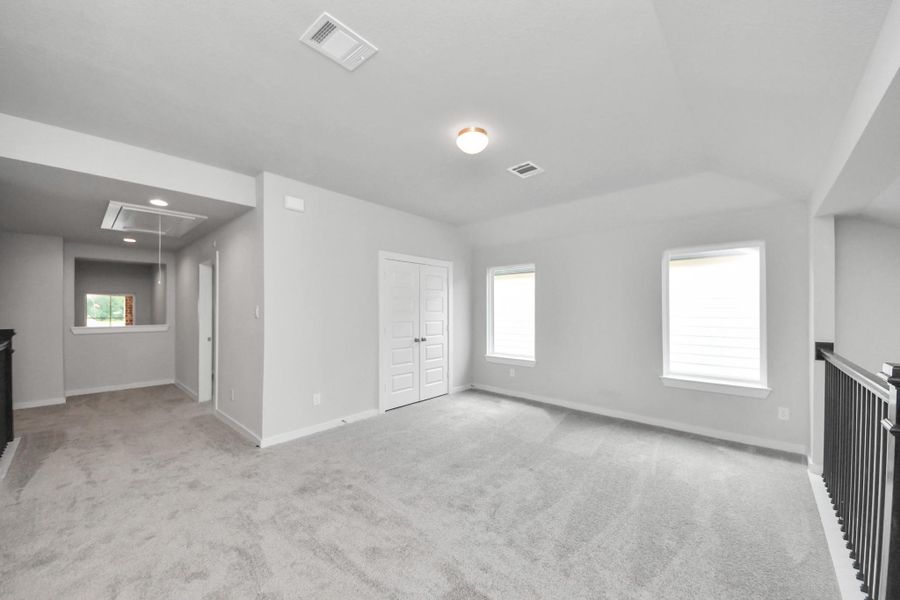 Come upstairs and enjoy a day of leisure in this fabulous game room! This is the perfect hangout spot or adult game room! Features plush carpet, high ceilings, custom paint and windows for plenty of natural light. Come upstairs and enjoy a day of leisure in this fabulous game room! This is the perfect hangout spot or adult game room! Features plush carpet, high ceilings, custom paint and windows for plenty of natural light.