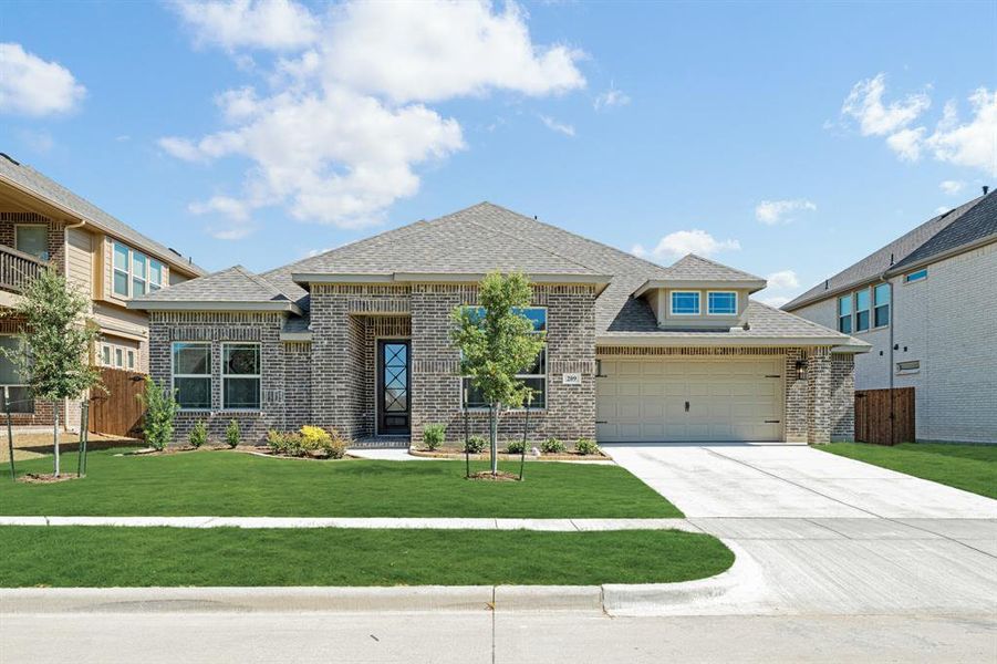 Front exterior of a new home in Hampton Park, Glenn Heights, TX, highlighting curb appeal (Image 25). Front exterior of a new home in Hampton Park, Glenn Heights, TX, highlighting curb appeal (Image 25).