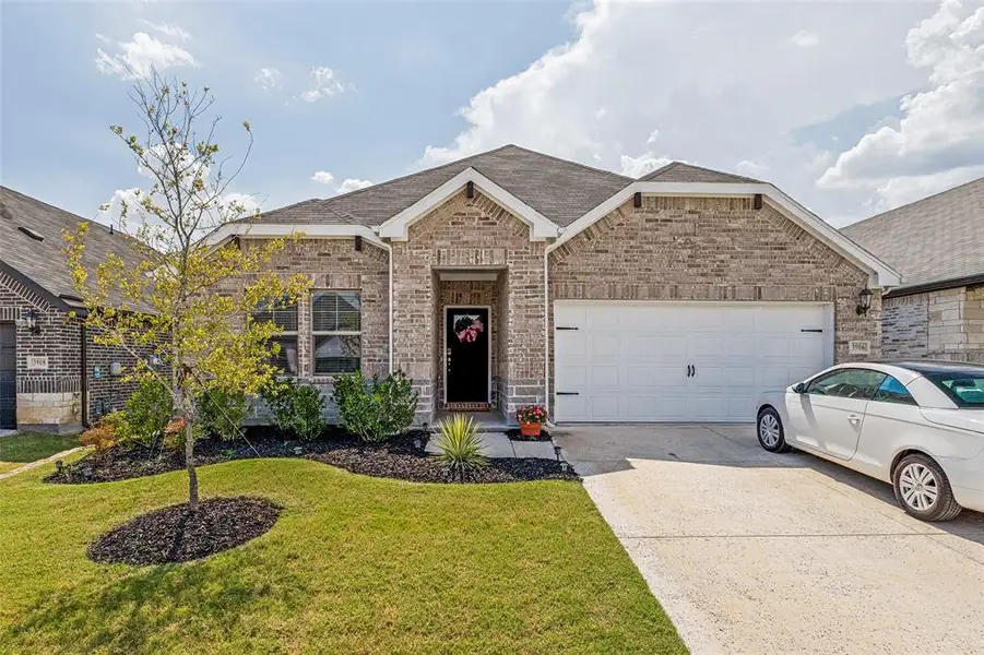 Front exterior of a new home in Lakehaven - Signature Series, Farmersville, TX, highlighting curb appeal (Image 1). Front exterior of a new home in Lakehaven - Signature Series, Farmersville, TX, highlighting curb appeal (Image 1).