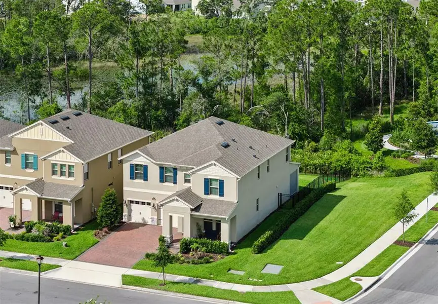 Front exterior of a new home in , Winter Garden, FL, highlighting curb appeal (Image 24).