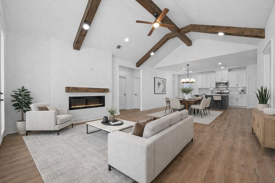 Bright and open entry leading into the main living space with soaring ceilings and natural light. Virtually Staged.