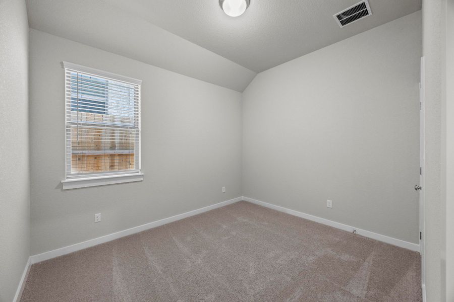 Bedroom in the Cedar home plan by Trophy Signature Homes – REPRESENTATIVE PHOTO