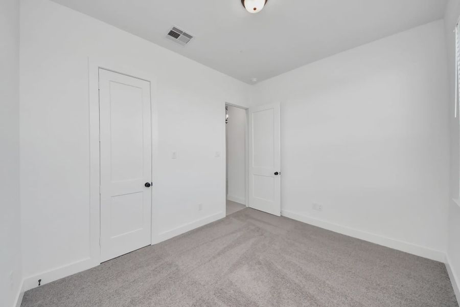 Representative unfurnished interior of a home built from the Summerton by Chesmar Homes in Meridiana 50's and 60's, Manvel (Image 51).