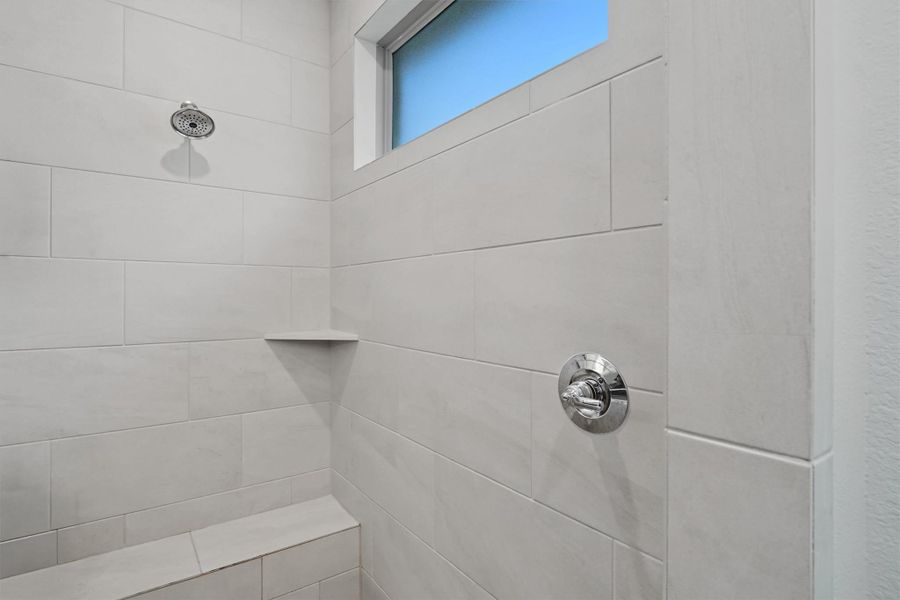 Large, walk in and fully tiled stand alone shower and bench seat Large, walk in and fully tiled stand alone shower and bench seat