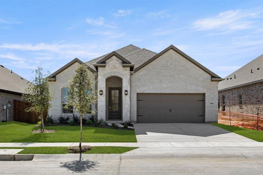 Front exterior of a new home in Country Lakes, Lantana, TX, highlighting curb appeal (Image 2). Front exterior of a new home in Country Lakes, Lantana, TX, highlighting curb appeal (Image 2).